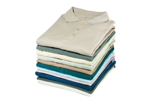 folded shirts on white background